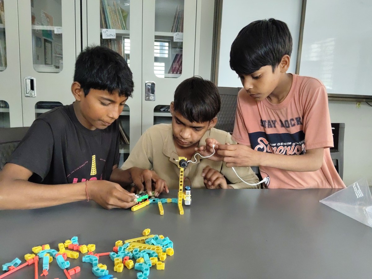 Students collaborating on an electronics tinkering project